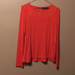 Burnt orange colored blouse